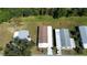 Aerial view of homes with neatly trimmed lawns in a quiet neighborhood at 861 Seabrooke Dr, Englewood, FL 34223