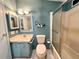 Bathroom features tiled floor and walk-in shower at 861 Seabrooke Dr, Englewood, FL 34223