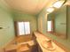 Bathroom with a soaking tub at 861 Seabrooke Dr, Englewood, FL 34223
