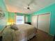 Bedroom showcasing hardwood floors, a ceiling fan, closet and natural light at 861 Seabrooke Dr, Englewood, FL 34223