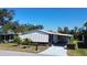 Cozy single-story home with a carport and well-maintained landscaping, perfect for comfortable living at 861 Seabrooke Dr, Englewood, FL 34223