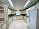 Functional kitchen with great countertop space, white appliances, and an efficient layout at 861 Seabrooke Dr, Englewood, FL 34223