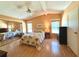 Cozy main bedroom featuring hardwood floors, a ceiling fan, and a mirrored closet at 861 Seabrooke Dr, Englewood, FL 34223