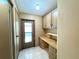 This mud room has built in cabinets, drawers, and a butcher block counter top at 861 Seabrooke Dr, Englewood, FL 34223