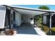 Covered patio with privacy trellis and access to the main dwelling at 861 Seabrooke Dr, Englewood, FL 34223