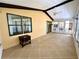Bright sunroom with tile floor, ceiling fan and access to main house at 861 Seabrooke Dr, Englewood, FL 34223