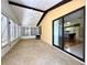 Bright sunroom with tile floor, ceiling fan and access to main house at 861 Seabrooke Dr, Englewood, FL 34223