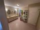 Spacious bathroom with double vanity, ample lighting, and decorative room divider at 1022 Waterside St, Port Charlotte, FL 33952