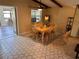 Inviting dining area featuring warm lighting, a wooden table set, and stylish flooring at 1022 Waterside St, Port Charlotte, FL 33952