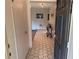 View of the home's entry foyer with decorative tile and wood flooring, creating a stylish entrance at 1022 Waterside St, Port Charlotte, FL 33952