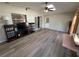 Spacious living room with lots of natural light, wood floors, and French door to the exterior at 1022 Waterside St, Port Charlotte, FL 33952