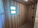 Tiled shower with a window providing natural light and a modern showerhead fixture at 1022 Waterside St, Port Charlotte, FL 33952