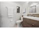 Bright bathroom with modern vanity, framed art, and neutral walls at 1080 Bal Harbor Blvd # 10C, Punta Gorda, FL 33950