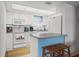 Well-lit kitchen with ample counter space, modern appliances, and a cozy breakfast bar at 1080 Bal Harbor Blvd # 10C, Punta Gorda, FL 33950