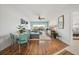 Open-concept living area with laminate floors, a comfortable sectional, and bright, natural light at 1080 Bal Harbor Blvd # 10C, Punta Gorda, FL 33950