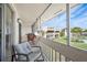 Inviting screened-in patio with comfortable seating and community views at 1080 Bal Harbor Blvd # 10C, Punta Gorda, FL 33950
