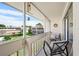 Relaxing screened-in patio with seating overlooking the well-maintained community at 1080 Bal Harbor Blvd # 10C, Punta Gorda, FL 33950