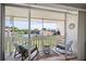Inviting screened-in patio with comfortable seating overlooking a serene community at 1080 Bal Harbor Blvd # 10C, Punta Gorda, FL 33950