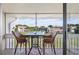 Relaxing screened-in patio with seating overlooking the lush community and pool area at 1080 Bal Harbor Blvd # 10C, Punta Gorda, FL 33950