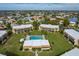 Overhead view displays shared pool area surrounded by well-maintained condos and landscaping at 1080 Bal Harbor Blvd # 10C, Punta Gorda, FL 33950