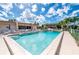 Community pool and outdoor lounge area, perfect for relaxation and recreation at 1080 Bal Harbor Blvd # 10C, Punta Gorda, FL 33950