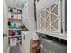 Utility room with stacked washer/dryer and storage shelving at 1080 Bal Harbor Blvd # 10C, Punta Gorda, FL 33950