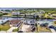 Aerial view capturing the waterfront home with nearby canal access and residential surroundings at 12387 Minot Ave, Port Charlotte, FL 33981