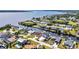 Waterfront homes with private docks line tranquil canals in this scenic aerial view near a beautiful bay at 12387 Minot Ave, Port Charlotte, FL 33981