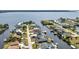 Waterfront homes with private docks line tranquil canals in this scenic aerial view near a beautiful bay at 12387 Minot Ave, Port Charlotte, FL 33981