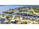 Waterfront homes with private docks line tranquil canals in this scenic aerial view near a beautiful bay at 12387 Minot Ave, Port Charlotte, FL 33981