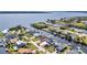 Waterfront homes with private docks line tranquil canals in this scenic aerial view near a beautiful bay at 12387 Minot Ave, Port Charlotte, FL 33981