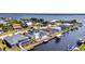 Waterfront homes with private docks line tranquil canals in this scenic aerial view near a beautiful bay at 12387 Minot Ave, Port Charlotte, FL 33981
