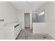 Bathroom with double sink vanity, walk-in shower and open doorway at 12387 Minot Ave, Port Charlotte, FL 33981