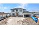 Modern two-story home featuring a stylish exterior with a spacious open garage at 12387 Minot Ave, Port Charlotte, FL 33981