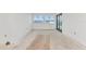 Bright living room featuring fresh white walls, large windows, and sliding door at 12387 Minot Ave, Port Charlotte, FL 33981