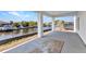 Covered patio view overlooking the water, perfect for relaxing outdoors at 12387 Minot Ave, Port Charlotte, FL 33981