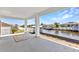 Spacious covered patio with views of the waterfront and boat docks at 12387 Minot Ave, Port Charlotte, FL 33981