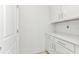 Room featuring white cabinets with light countertops and an entrance doorway at 12387 Minot Ave, Port Charlotte, FL 33981