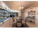 Charming dining area overlooking a tranquil outdoor space with pool and canal view at 12676 Bacchus Rd, Port Charlotte, FL 33981