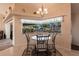 Cozy dining area with chandelier and a view of the pool and lanai at 12676 Bacchus Rd, Port Charlotte, FL 33981