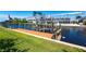 Waterfront property with a private dock and boat lift, offering direct access to the water at 12676 Bacchus Rd, Port Charlotte, FL 33981