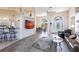 Spacious open-concept living area with tile floors, dining area, kitchen, and plenty of natural light at 12676 Bacchus Rd, Port Charlotte, FL 33981