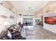 Inviting living room with tile flooring, comfortable seating, and a view of the outdoor patio at 12676 Bacchus Rd, Port Charlotte, FL 33981
