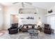 Cozy living room features comfortable seating, tile flooring, and decorative niches in the walls at 12676 Bacchus Rd, Port Charlotte, FL 33981