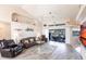 Bright living room with tile floors, neutral decor, comfortable seating, and access to the outdoor area at 12676 Bacchus Rd, Port Charlotte, FL 33981