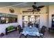 Covered patio showing the interior of the home through large windows at 12676 Bacchus Rd, Port Charlotte, FL 33981