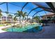 Pool with tropical landscaping and waterfront views at 12676 Bacchus Rd, Port Charlotte, FL 33981