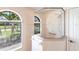 Corner shower enclosed with a decorative glass design and window views at 12676 Bacchus Rd, Port Charlotte, FL 33981