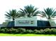 Elegant community entrance sign for Cypress Falls at The Woodlands amidst lush landscaping at 1352 Raspberry Dr, North Port, FL 34289