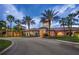 Stunning exterior elevation of a luxurious home showcasing lush landscaping and a grand entrance at 1352 Raspberry Dr, North Port, FL 34289